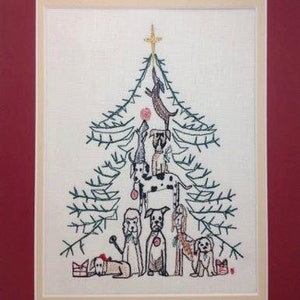 May include: Embroidered Christmas tree design featuring a variety of dogs in different poses, including a dog holding a ball at the top of the tree.