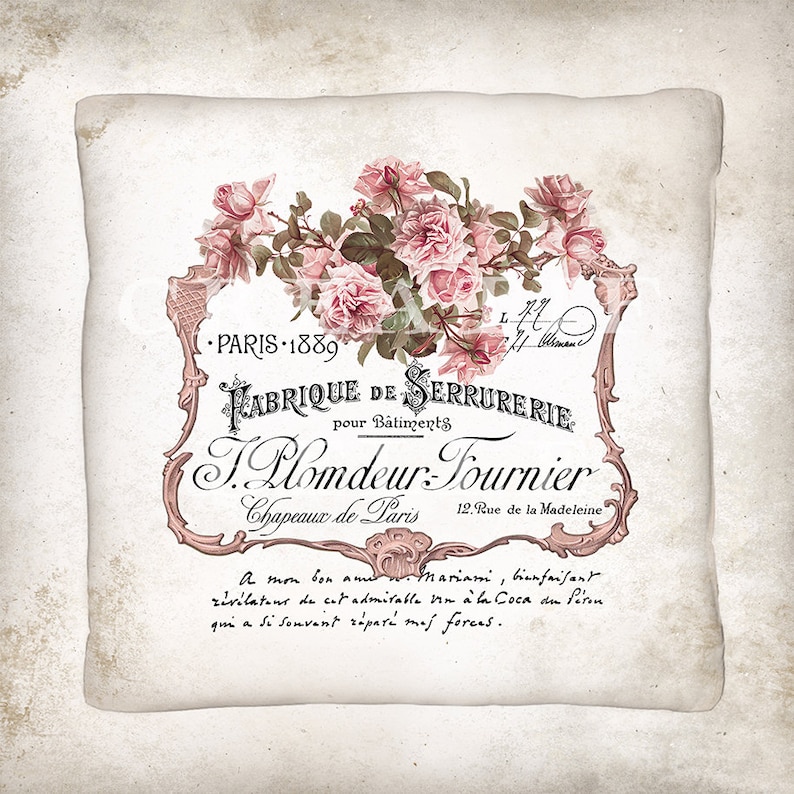 May include: A vintage-style label with pink roses and ornate lettering. The text reads "Fabrique de Serrurerie pour B&acirc;timents T. Plomdeur-Tournier Chapeaux de Paris 12. Rue de la Madeleine. A mon bon ami Mariani, bienfaisant r&eacute;v&eacute;lateur de cet admirable vin &agrave; la Coca du P&eacute;ron qui a si souvent r&eacute;par&eacute; mes forces."