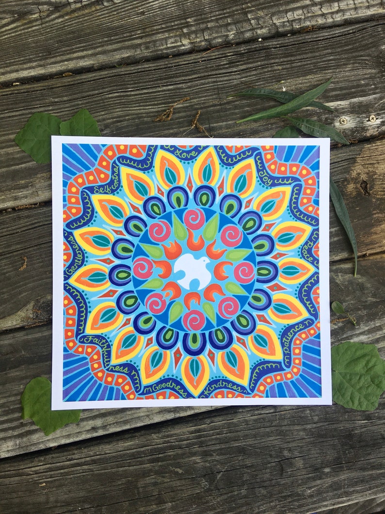 May include: A colorful mandala design with a white dove in the center. The mandala is surrounded by a circle of words, including "love", "joy", "peace", "patience", "kindness", "goodness", "faithfulness", "gentleness", "self-control", and "wisdom".