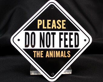 Vintage “Please Do Note Feed the Animals” Metal Sign  |  Tony Stone Images Promotion