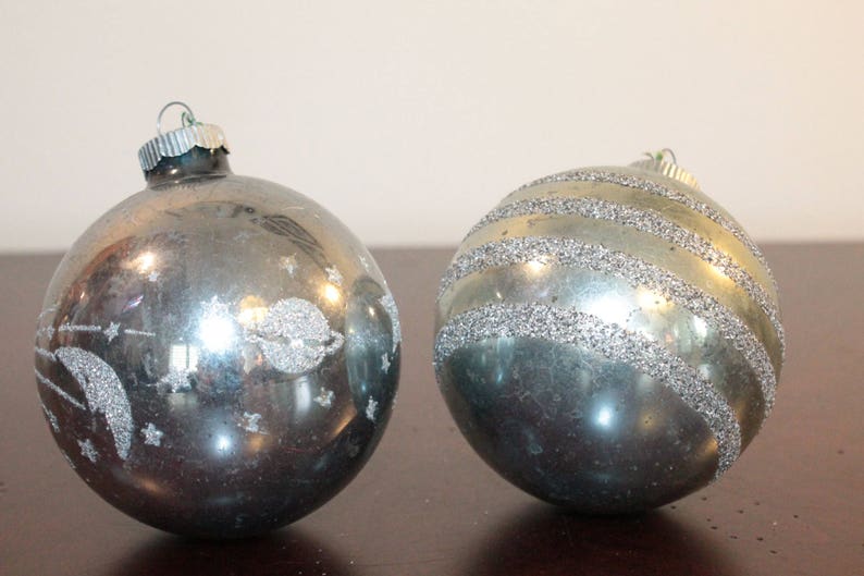 TWO \u2013 Two Shiny Brite Oversized Pale Blue Ornaments with Glitter \u2013 One Horizontal Stripes and One with Moon Shooting Stars and Saturn