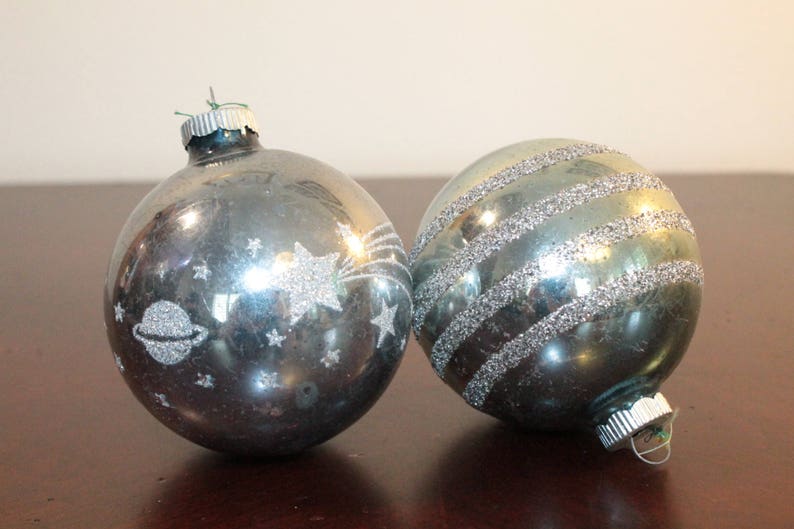 TWO \u2013 Two Shiny Brite Oversized Pale Blue Ornaments with Glitter \u2013 One Horizontal Stripes and One with Moon Shooting Stars and Saturn