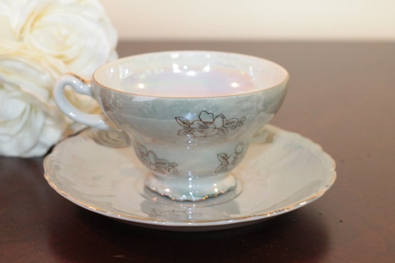 Iridescent Tea Cup and Saucer Gold Trim Yellow Lily Flowers