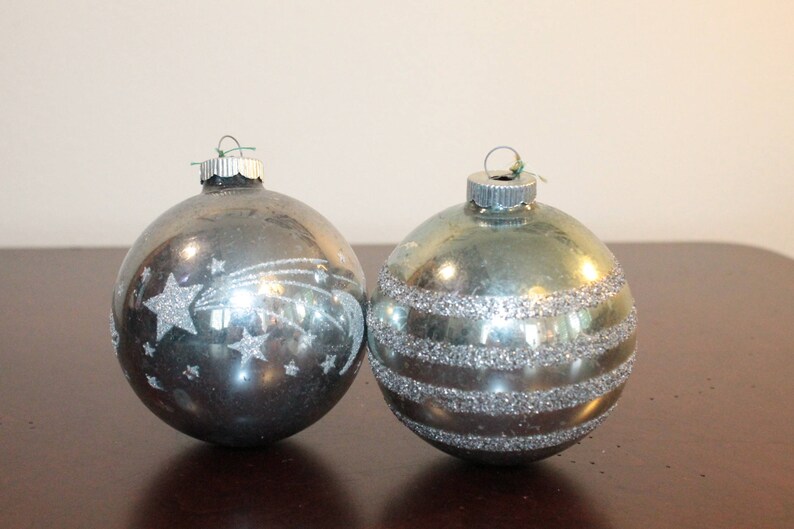 TWO \u2013 Two Shiny Brite Oversized Pale Blue Ornaments with Glitter \u2013 One Horizontal Stripes and One with Moon Shooting Stars and Saturn