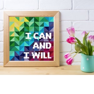 May include: A framed piece of art with a colourful geometric pattern and the text "I CAN AND I WILL" in white letters.