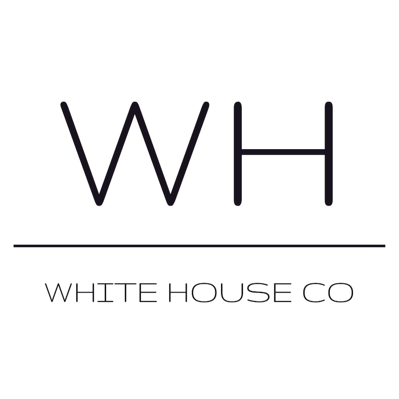 May include: Black and white logo for White House Co. The logo features a stylized "WH" with a line underneath.