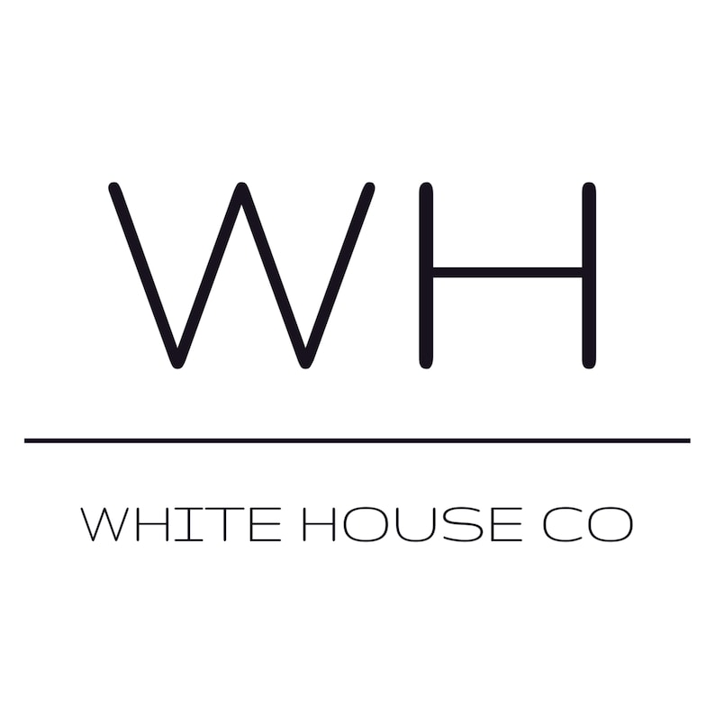May include: Black and white logo for White House Co. The logo features a stylised "WH" with a line underneath.