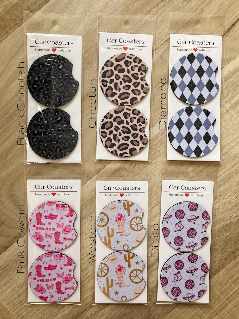 May include: Set of 10 car coasters with various designs, including cheetah print, diamond pattern, cowboy boots, and cacti. Each coaster is handmade and features the text "Car Coasters" and "Handmade with love".
