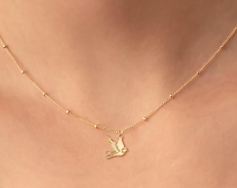 Collar con dije de golondrina volando y cadena de cuentas: plata de ley, chapado en oro, oro rosa, oro macizo de 14 quilates. Joyería de animales con forma de pájaro. Regalo ideal.