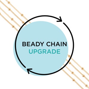 May include: A graphic with a circular arrow pointing clockwise around a light blue circle with the text "BEADY CHAIN UPGRADE" in black and teal text.  Four gold chains with small beads are shown in the background.