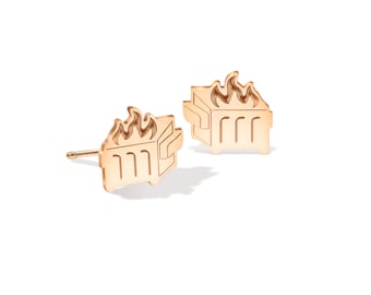 May include: A pair of gold-toned earrings shaped like a dumpster with flames on top.