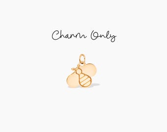 May include: Gold-toned bee charm with a striped body. Charm Only.