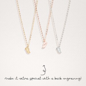 May include: Three gold, rose gold, and silver necklaces with a shoe charm. The rose gold charm has the name "Amy" engraved on it. The text "make it extra special with a back engraving!" is at the bottom of the image.