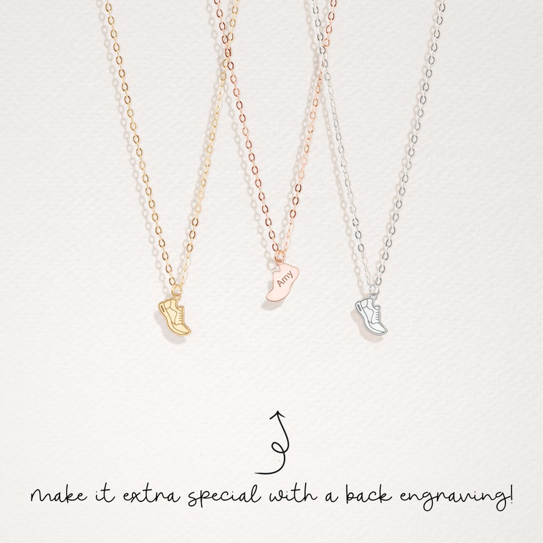 May include: Three gold, rose gold, and silver necklaces with a shoe charm. The rose gold charm has the name "Amy" engraved on it. The text "make it extra special with a back engraving!" is at the bottom of the image.