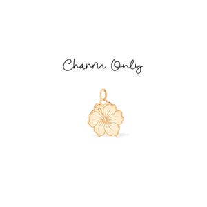 May include: A gold-colored flower charm with a loop for attaching to a necklace or bracelet. The charm has a detailed floral design with a light cream-colored center. The words "Charm Only" are written above the charm.