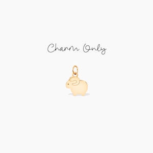 May include: Gold-toned metal charm shaped like a cartoon sheep. Charm Only.