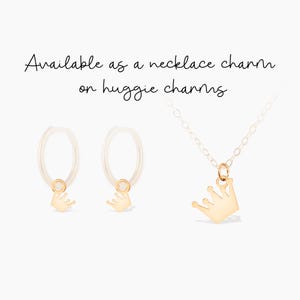 May include: Gold crown charm necklace and matching huggie earrings. The crown charm is on a delicate chain and the huggie earrings have a small gold crown dangling from each hoop.  Available as a necklace charm or huggie charms.