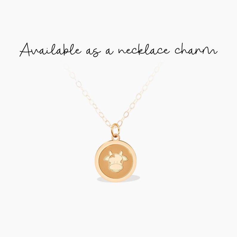 This charming gold cow pendant necklace is perfect for animal lovers or farmers. Its playful design adds a whimsical touch, making it a delightful gift for birthdays or special occasions.