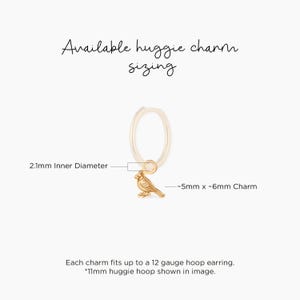 Cardinal bird charm pendant in gold tone, tiny sculpted bird with loop, fits huggie hoop earring, sleek modern style, great pick for bird lovers or memorial theme buyers looking to add a charm