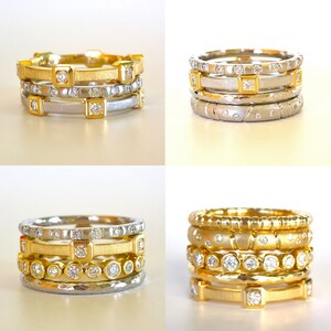 K&ouml;nnte beinhalten: Vier stapelbare Ringe mit einer goldenen und silbernen Oberfl&auml;che. Die Ringe sind mit kleinen Diamanten verziert und haben verschiedene Texturen.