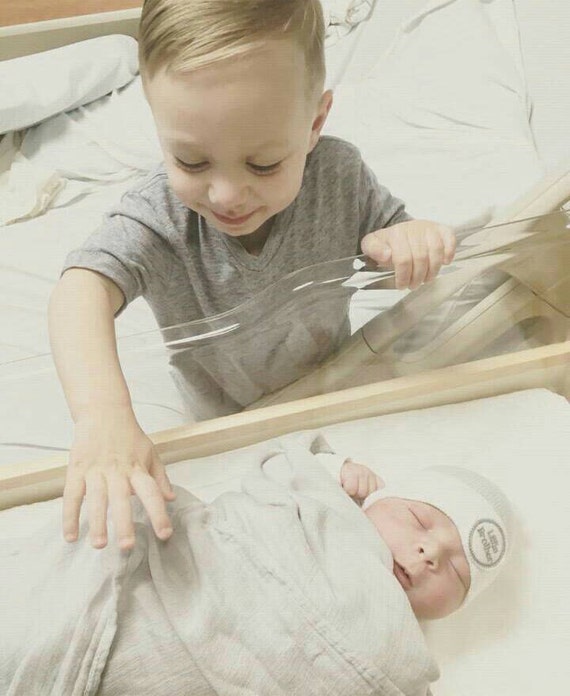 Newborn Little Brother Hat. White hat with gray little brother