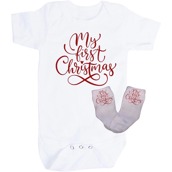 First Christmas Baby Bodysuit with Option to add Socks and No Scratch Mittens. Size 0-3 Months to 24 Months. EXCLUSIVELY FOUND HeRe!