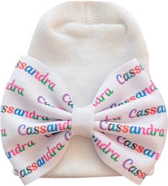 Name Bow on white Hat. Newborn Size Hat. You select name color and bow size at checkout. Great Photo Prop.