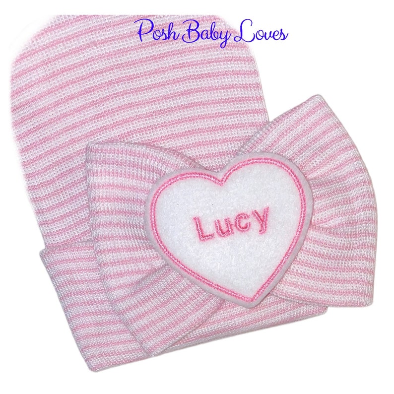 Pink and white stripe newborn hat with pink name on heart