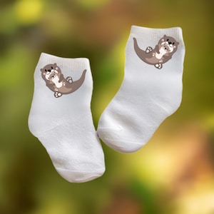 Baby/Toddler/Child Otter Holding Baby Socks. Multiple sizes offered. Choose from 0-6 months to 10 years.  Every Baby Needs. Cute Baby Gift!