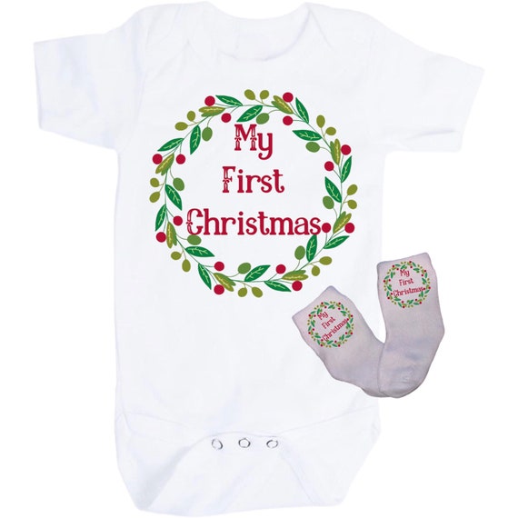 First Christmas Baby Bodysuit with Option to add Socks and No Scratch Mittens. Size 0-3 Months to 24 Months. EXCLUSIVELY FOUND HeRe!