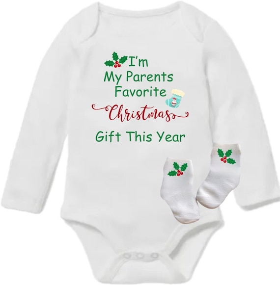 Christmas Baby Bodysuit with Socks. I’m My Parents Favorite Christmas Gift. Size PREEMIE to 24 Months. EXCLUSIVELY FOUND HeRe