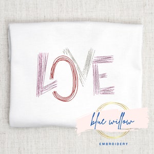 May include: Embroidered "LOVE" design in red, pink, and gray thread on a white fabric background. The design is from Blue Willow Embroidery.
