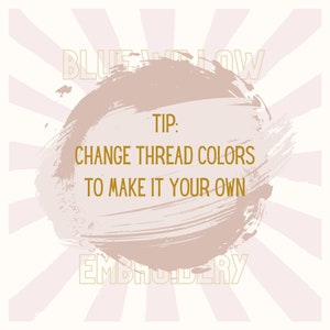 May include: A light brown circle with a brushstroke effect, with the text "BLUE YELLOW EMBROIDERY" in gold at the top and bottom. The text "TIP: CHANGE THREAD COLORS TO MAKE IT YOUR OWN" is in gold in the center of the circle.