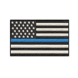 May include: An embroidered American flag patch with a thin blue line across the middle, representing support for law enforcement.