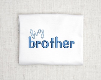 May include: White t-shirt with blue embroidered text that reads "big brother".