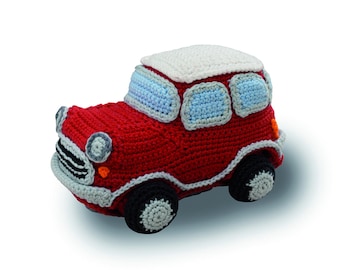 May include: A red crocheted toy car with a white roof and blue windows. The car has black wheels with gray spokes.