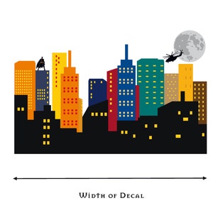May include: A colourful cityscape decal with a black silhouette of a helicopter flying over a full moon. The decal features a black silhouette of a superhero standing on a building.