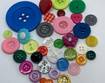 Assorted buttons in batches of 50