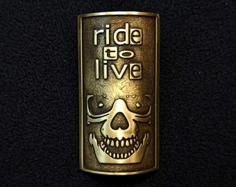 Headbadge for bicycle. Ride to Live. Today!. Brass.