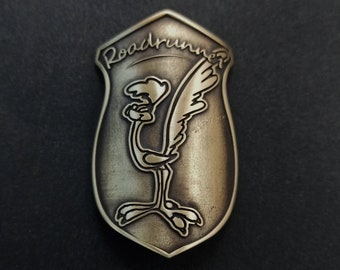 Headbadge for bicycle. Roadrunner insignia. Brass.