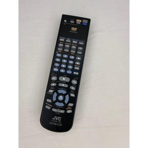 May include: Black JVC DVD & VCR remote control with numerous buttons for various functions. The remote has a power button, volume controls, and number keys. The model number LP21030-030 is visible on the bottom of the remote.