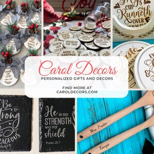 May include: A collage of personalized gifts and decor items. Includes Christmas ornaments, coasters, slate signs with inspirational quotes, and wooden spoons. The image features the text "Carol Decors" and "Personalized Gifts and Decors".