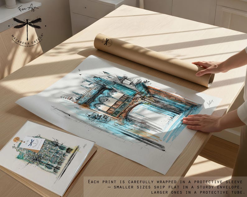 May include: An architectural watercolor print with blue and brown tones, alongside a smaller print and a rolled tube. The larger print is being handled on a light wood surface. The text on the image says "Each print is carefully wrapped in a protective sleeve - smaller sizes ship flat in a sturdy envelope, larger ones in a protective tube."