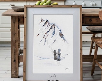 May include: A framed watercolor print featuring a snow-covered mountain range with two snowboards standing upright in the foreground. The artwork includes a signature in the bottom right corner and the text Fine Art at the bottom center.
