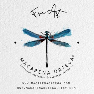 May include: A watercolor dragonfly design with blue wings and a black body, set against a white background. The words "Fine Art" are above the dragonfly, and the artist's name and website are below.