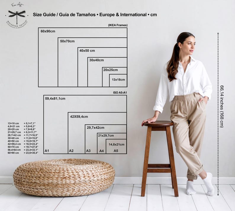 May include: A size guide chart in black displays dimensions in centimeters for European and international frames, with corresponding inch measurements. A woman stands near a wooden stool, with a woven ottoman in the foreground. The height is 66.14 inches (168 cm).