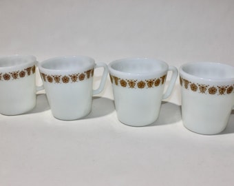 vintage 1970's Set of 4 -Pyrex- coffee mugs. Opal glass w/ 'Golden Butterfly' pattern around rim. No. 1410.