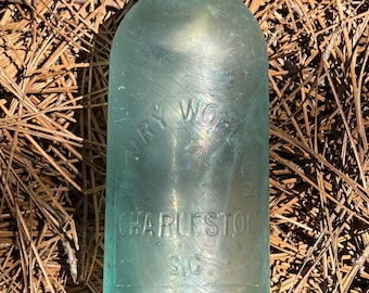 antique 1880's -Henry Wohlken / Charleston, S.C.- Hutchinson style, soda bottle. Aqua. Applied top. Scarce and highly collectible!