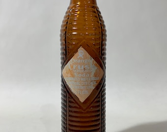 vintage c. 1930's -Orange Crush- soda bottle. 'Douglas, Arizona'. Pyro label on Amber glass bottle w/ cap. Coca- Cola product