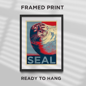 May include: A framed print featuring a seal with the word "SEAL" in large, bold lettering beneath it. The seal is shown in a red, white and blue colour scheme, similar to a political campaign poster.